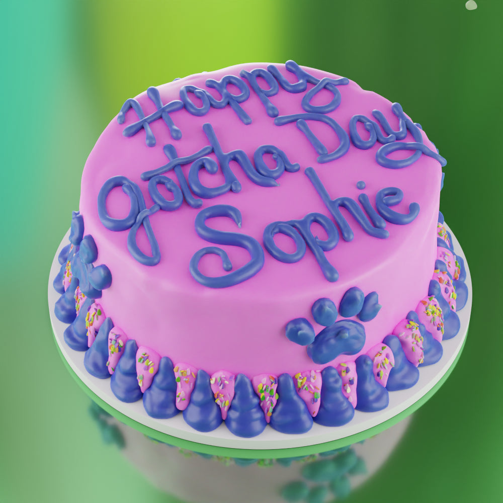 Pink and blue personalized dog birthday cake with Happy Birthday Sophie written on top