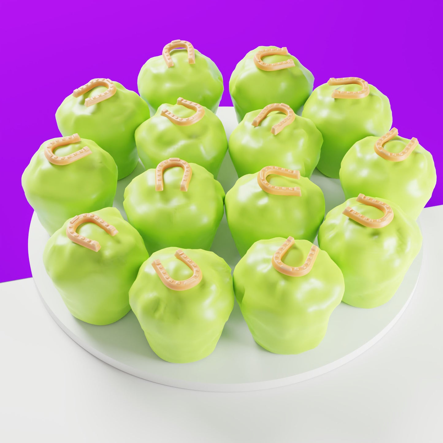 Fourteen light green mini Clip Clop cakes for horses with horseshoe icing decorations on a white platter