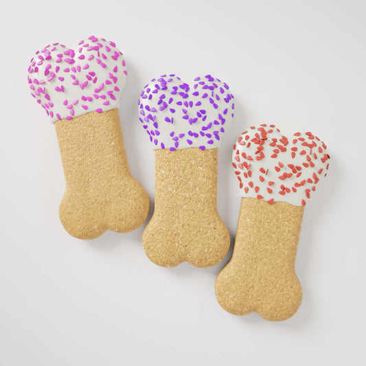 Three Party Bone dog cookies dipped in colorful yogurt and topped with sprinkles