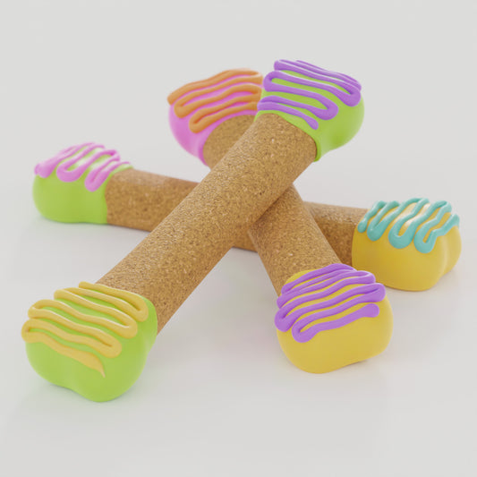 Perfect Bones dog biscuits decorated with pink, yellow, green, and purple dipped ends