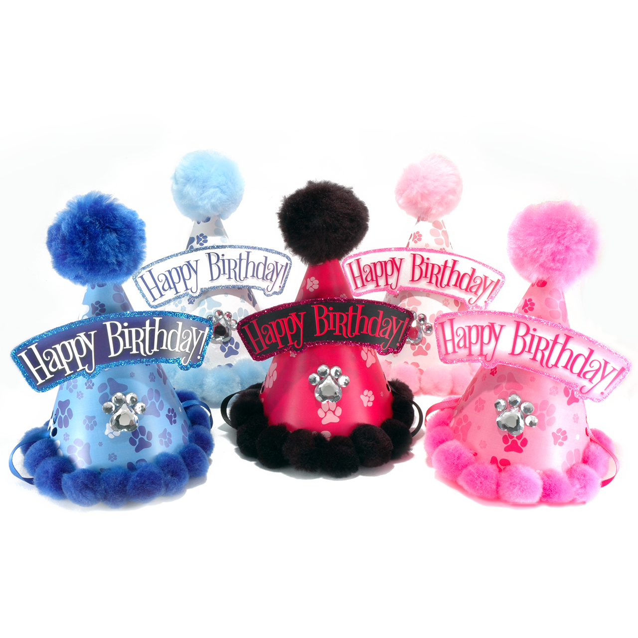 Four colorful birthday party hats arranged on a white background, each with a fluffy pom-pom top, a glittery brim, and a curved banner reading 'Happy Birthday!'. The hats come in blue, light blue, pink, and dark pink/black colorways, with small animal graphics on the front.