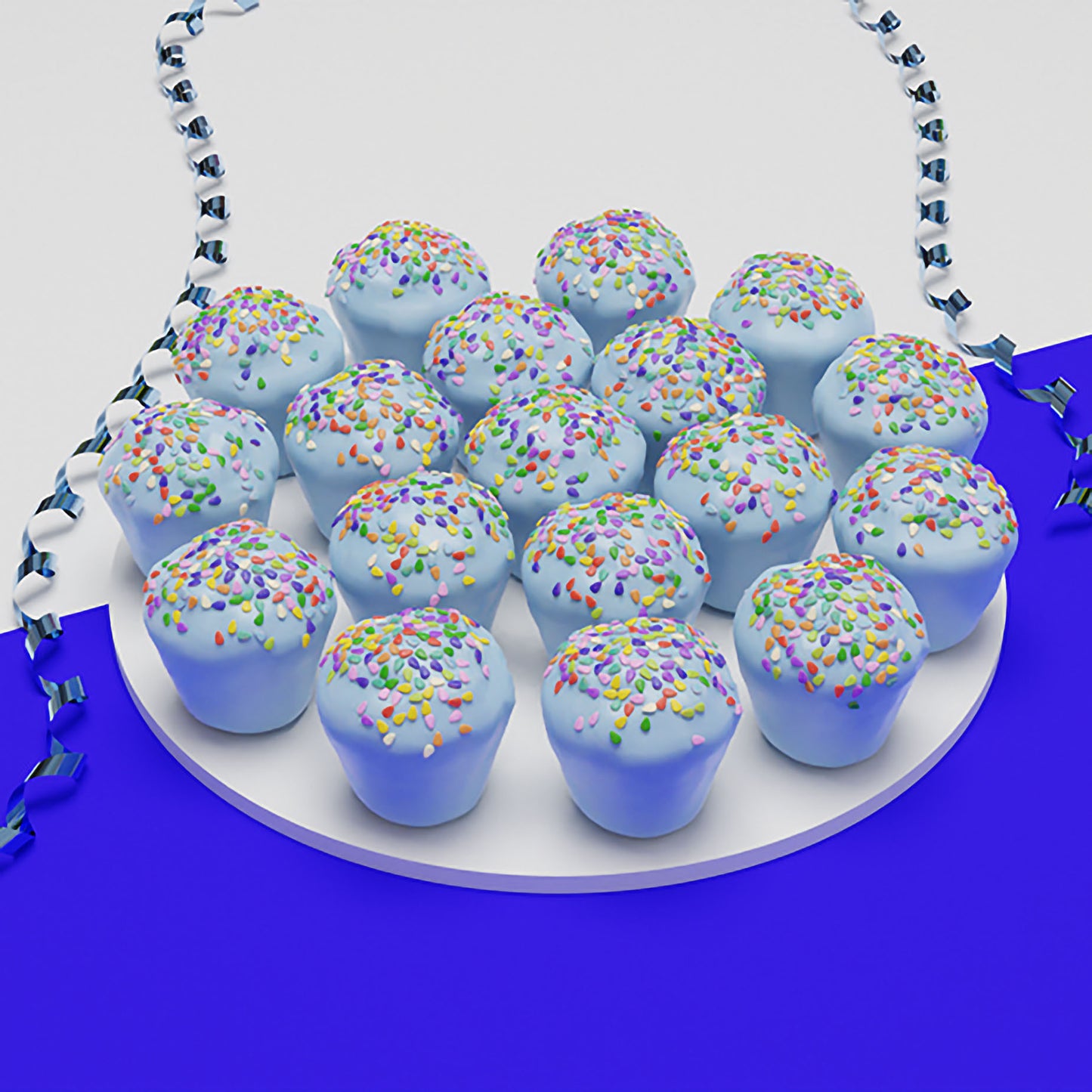 Eighteen light blue mini PupCup cakes for dogs topped with rainbow sprinkles on a white platter with blue party ribbon
